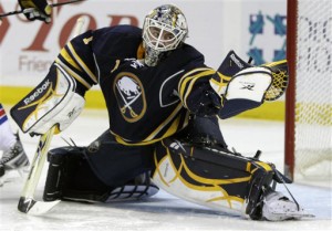 Buffalo Sabres goalie Jhonas  Enroth, of Sweden, makes a save on a shot by the New York Rangers during the second period of an NHL hockey game in Buffalo, N.Y., Wednesday, March 30, 2011. The Sabres won 1-0. (AP Photo/David Duprey)