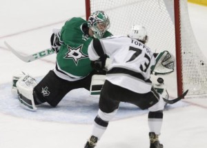 Los Angeles Kings center Tyler Toffoli (73) scores on Dallas Stars goalie Kari Lehtonen (32) during the first period of an NHL hockey game, Tuesday, March 15, 2016, in Dallas. (AP Photo/Tim Sharp)