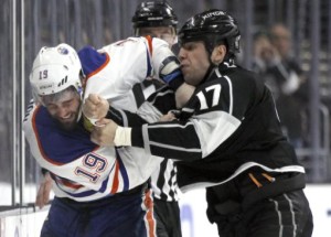 Edmonton Oilers left wing Patrick Maroon (19) and Los Angeles Kings left wing Milan Lucic (17) fight during the second period of an NHL hockey game in Los Angeles, Saturday, March 26, 2016. (AP Photo/Alex Gallardo)