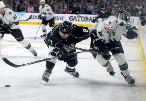 Apr 14, 2016; Los Angeles, CA, USA; Los Angeles Kings defenseman Drew Doughty (8) and San Jose Sharks left wing Matt Nieto (83) chase down the puck in the third period of the game one of the first round of the 2016 Stanley Cup Playoffs at Staples Center. Sharks won 4-3. Jayne Kamin-Oncea-USA TODAY Sports