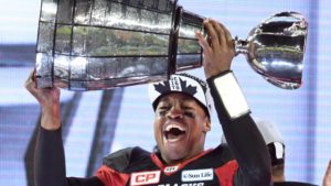 Redblacks QB Henry Burris hosting the Grey Cup for the third time after his team's shocking win at the 104th Grey Cup (Photo credit: Frank Gunn/The Canadian Press)